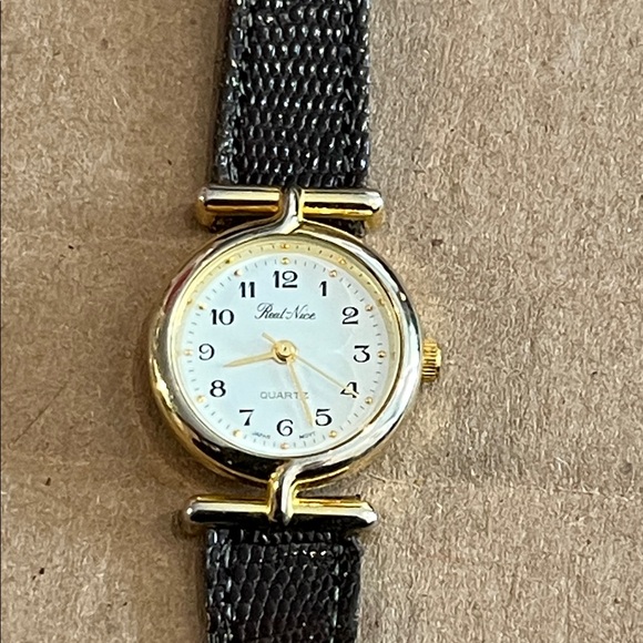 Brand “real nice” Gold and lizard brown band